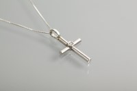 Lot 1286 - NINE CARAT WHITE GOLD DIAMOND SET CROSS...