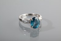 Lot 1287 - TOPAZ DRESS RING the large oval topaz set in...