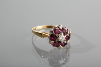 Lot 1289 - GARNET AND DIAMOND CLUSTER RING the daisy...