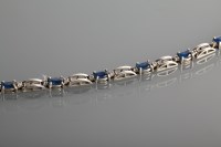 Lot 1337 - SAPPHIRE AND DIAMOND BRACELET set with oval...