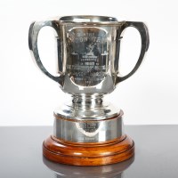 Lot 26 - THE GORDON TROPHY a silver three handled...