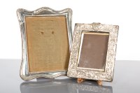 Lot 56 - SILVER PHOTOGRAPH FRAME of arched rectangular...