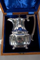 Lot 96 - SILVER OAK CASED HOT WATER POT of lobed oval...