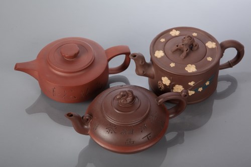 Lot 118 - THREE CHINESE TERRACOTTA TEAPOTS of circular...