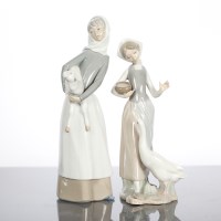 Lot 151 - TWO LLADRO PORCELAIN FIGURES of a girl with a...