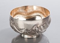 Lot 102 - CHINESE SILVER BOWL cast with dragons in...
