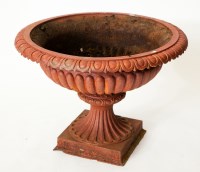 Lot 231 - RED PAINTED CAST IRON GARDEN URN with fluted...