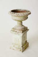 Lot 240 - WHITE PAINTED STONEWARE GARDEN URN on plinths,...