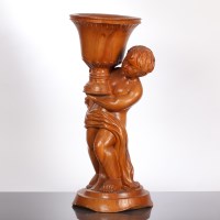 Lot 292 - CARVED WALNUT PLANTER in the form of a cherub...