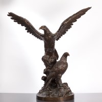 Lot 299 - MODERN BRONZE OF TWO EAGLES standing on a...