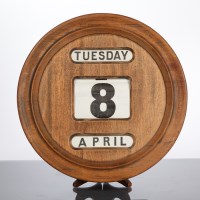 Lot 305 - EDWARDIAN CIRCULAR MAHOGANY WALL CALENDAR with...