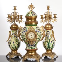 Lot 310 - BRASS MOUNTED CERAMIC CLOCK GARNITURE the...