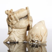 Lot 317 - JAPANESE BONE NETSUKE OF SHOULAO 5.5cm high;...