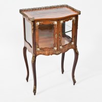 Lot 375 - LOUIS XVTH STYLE WALNUT VITRINE of serpentine...