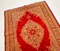 Lot 417 - PERSIAN RUG with single floral lozenge on a...