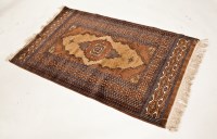 Lot 429 - AFGHAN RUG with central lozenge on chesnut...