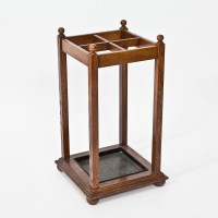 Lot 460 - EDWARDIAN OAK FOUR-DIVISION STICK STAND with...