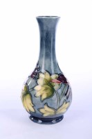 Lot 588 - MOORCROFT BOOTLE SHAPED VASE decorated with...