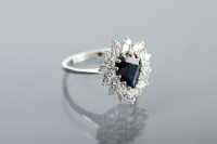 Lot 1111 - SAPPHIRE AND DIAMOND CLUSTER RING by Cavendish...