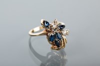 Lot 1113 - SAPPHIRE AND DIAMOND DRESS RING in a stylised...