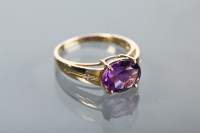 Lot 1136 - AMETHYST DRESS RING the oval amethyst set to...