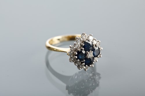 Lot 1151 - SAPPHIRE AND DIAMOND CLUSTER RING set with...