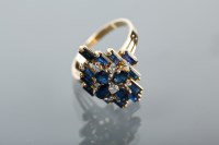 Lot 1185 - SAPPHIRE AND DIAMOND CLUSTER RING with pear...