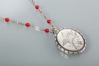 Lot 1189 - VICTORIAN SILVER LOCKET engraved with a...