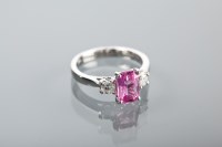 Lot 1198 - PINK SAPPHIRE AND DIAMOND THREE STONE RING the...
