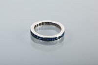 Lot 1208 - SAPPHIRE FULL ETERNITY RING with channel set...