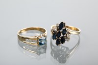 Lot 1215 - TWO GOLD DRESS RINGS the first set with...