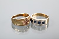 Lot 1216 - TWO GOLD DRESS RINGS one set with brown...