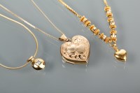 Lot 1221 - TWO GOLD PENDANTS ON CHAINS both in nine carat...