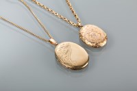 Lot 1300 - TWO LOCKETS ON CHAINS one of oval form with...
