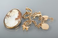Lot 1316 - NINE CARAT GOLD CHARM BRACELET with charms...