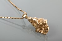 Lot 1359 - GOLD NUGGET PENDANT on a chain, approximately 23g