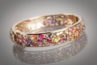 Lot 1370A - UNUSUAL MULTI GEM SET BANGLE set with...