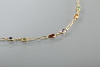 Lot 1373 - MULTI-GEM SET BRACELET with oval gems...