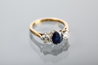 Lot 1375 - SAPPHIRE AND DIAMOND THREE STONE RING the...