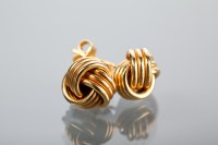 Lot 1379 - PAIR OF KNOT MOTIF EARRINGS with stud fixings,...