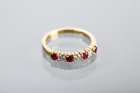 Lot 1392 - RUBY AND DIAMOND HALF ETERNITY RING in...