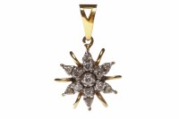 Lot 56 - DIAMOND SET PENDANT with a central round...