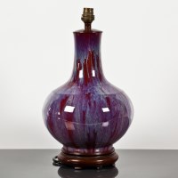 Lot 35 - CHINESE FLAMBE BOTTLE VASE with globular body...