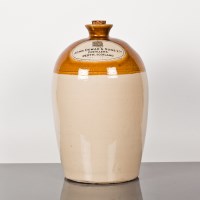 Lot 712 - DEWAR'S WHISKY FLAGON An empty stoneware...