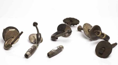 Lot 1057 - TWO CURLING STONE HANDLE GRIPS inlaid with...