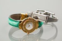 Lot 1049 - TWO LADIES GUCCI WATCHES AND A RAYMOND WEIL...