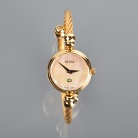 Lot 1051 - LADY'S GUCCI WRIST WATCH the round dial...