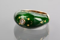 Lot 1114 - ENAMELLED DIAMOND SET RING enamelled in green...