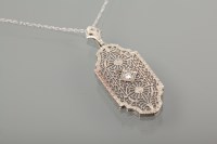 Lot 1119 - ART DECO DIAMOND SET PENDANT the fine pierced...