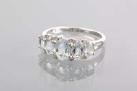 Lot 1124 - AQUAMARINE FIVE STONE RING set with five oval...